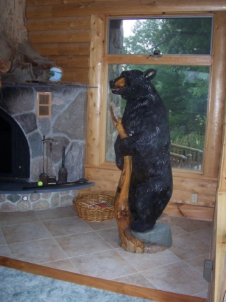 Bear Holding a Stump