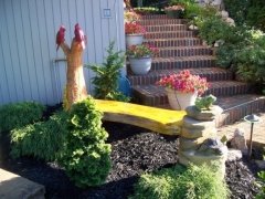 Bench with a Frog, Turtle, and Cardinals