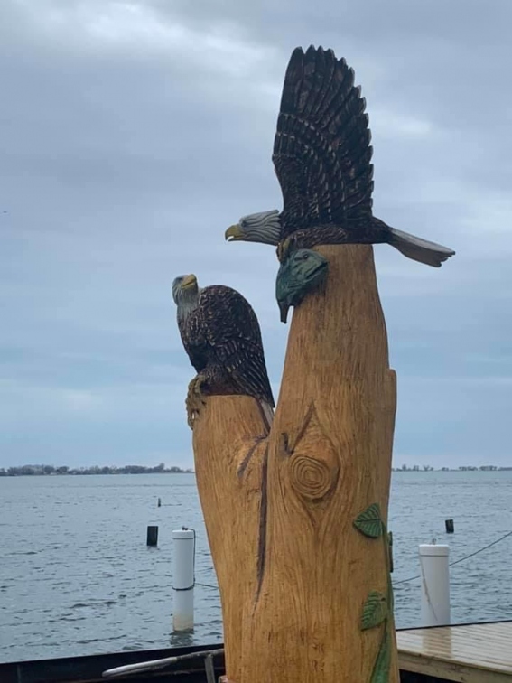 Two Eagles and a Fish on a Stump